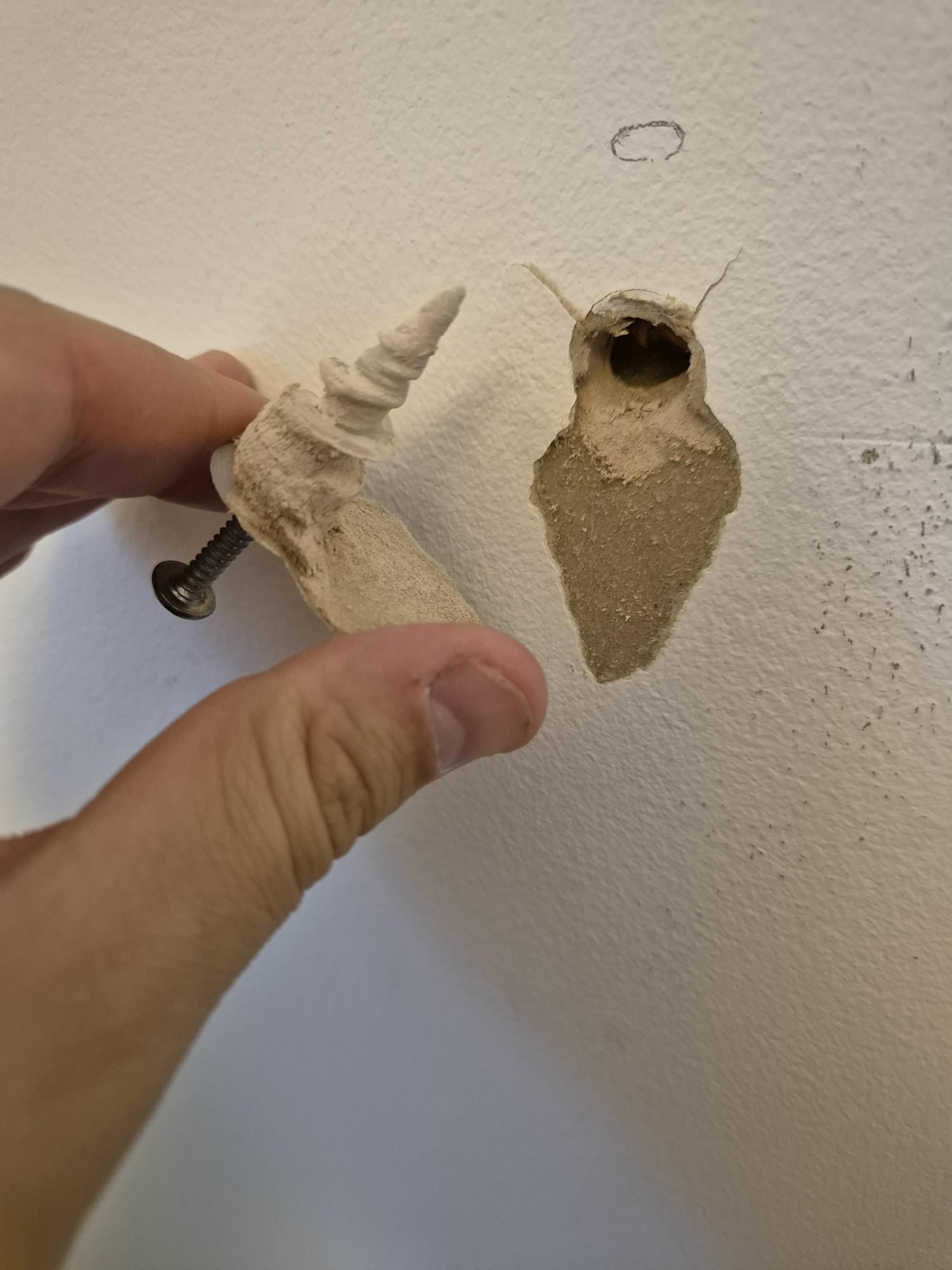Wall hole filled, sanded and painted by Doha Home Fix in a Doha home